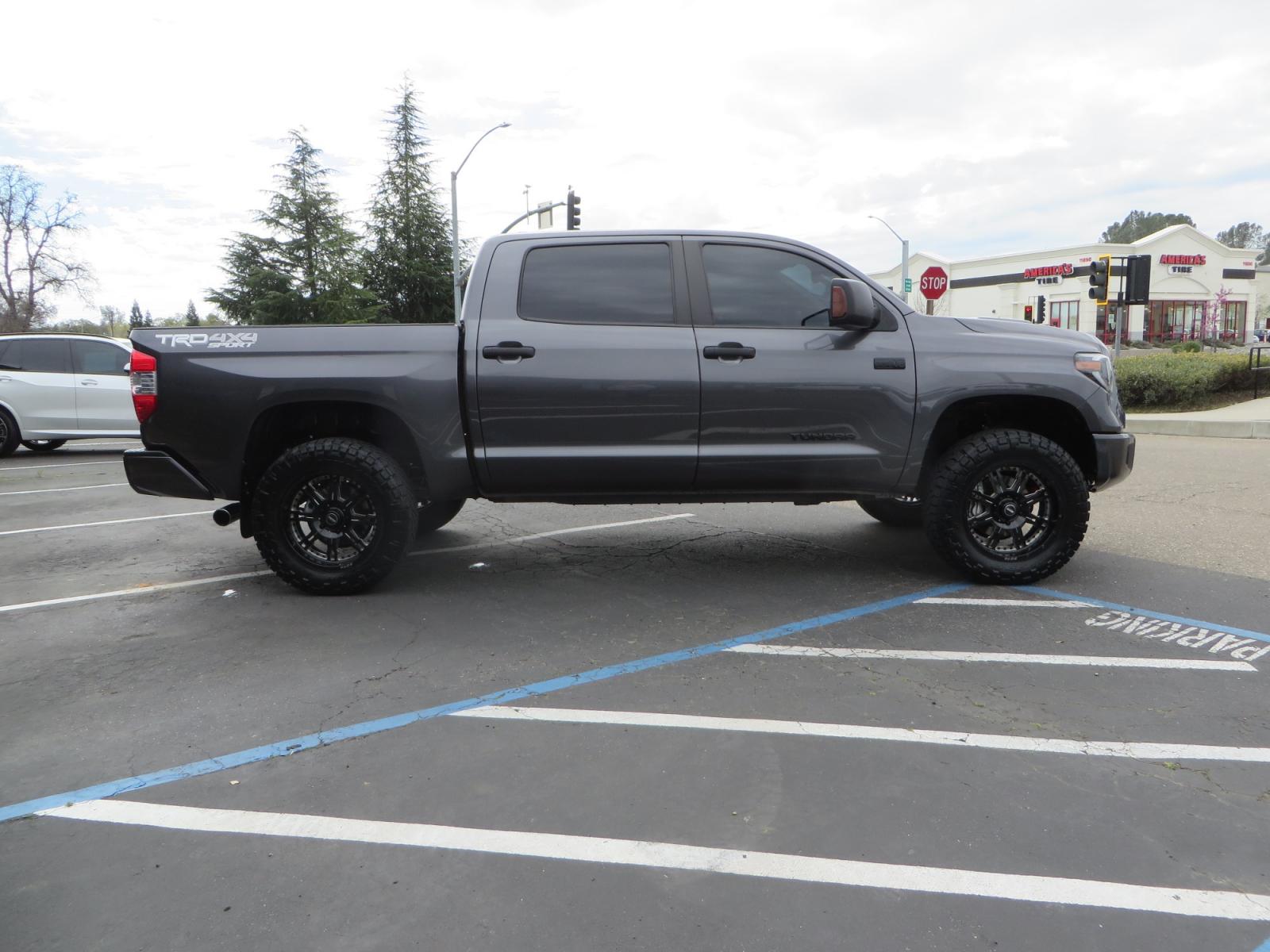 2021 CHARCOAL /GREY Toyota Tundra SR5 (5TFDY5F16MX) with an 5.7L V8 OHV 16V engine, automatic transmission, located at 2630 Grass Valley Highway, Auburn, CA, 95603, (530) 508-5100, 38.937893, -121.095482 - Features a Zone Offroad level kit, 20" SOTA wheels, 35" Nitto Ridge Grappler tires, Fox rear shocks, Air bags, front and rear TRD sway bars, and Window tint. - Photo #3